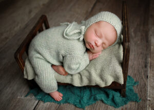baby posed on bed