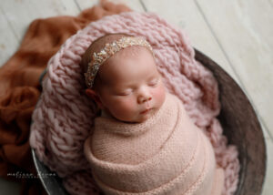 Baby girl portrait in pink