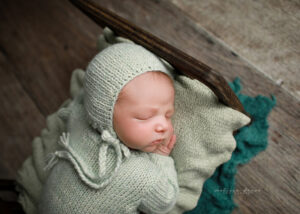 Baby boy in green outfit