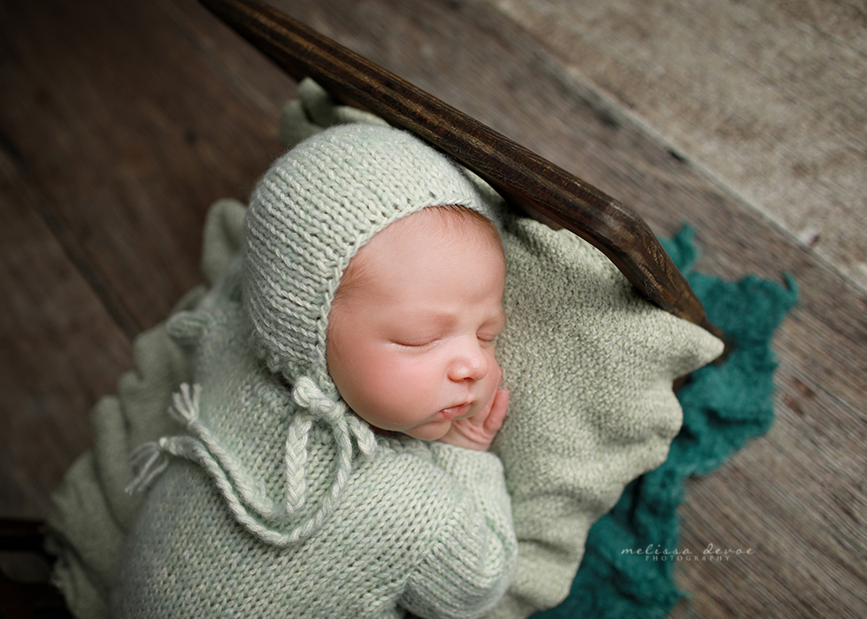 Baby boy in green outfit