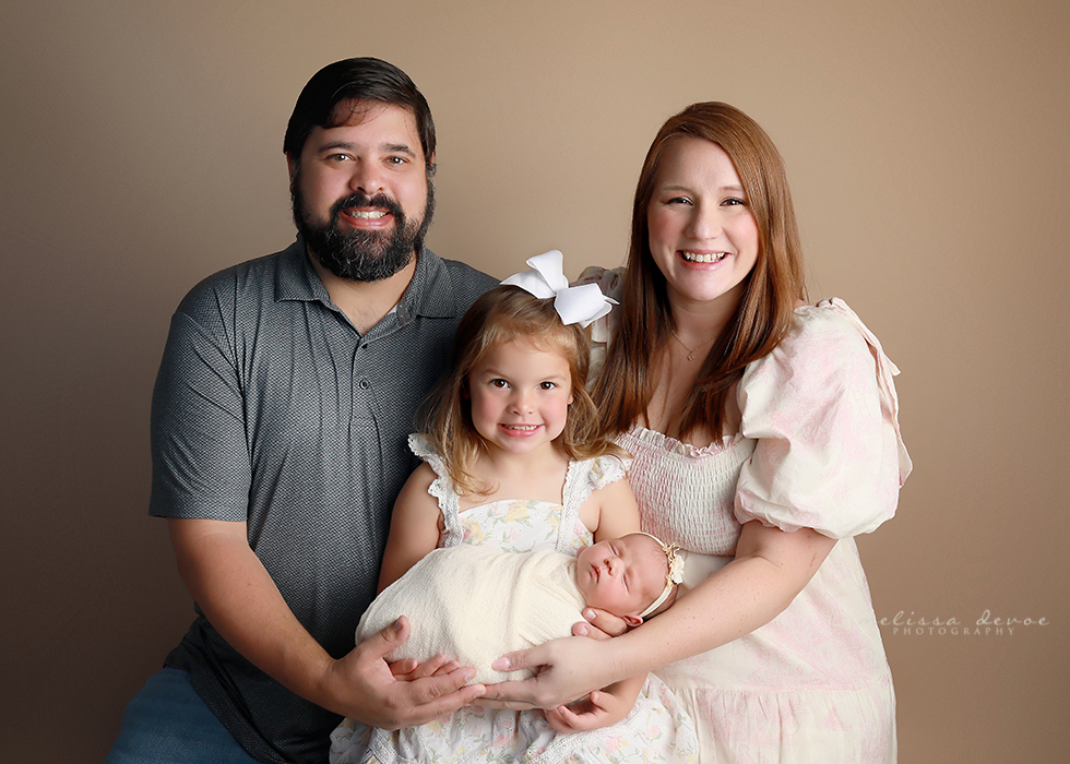 family portrait with newborn baby girl