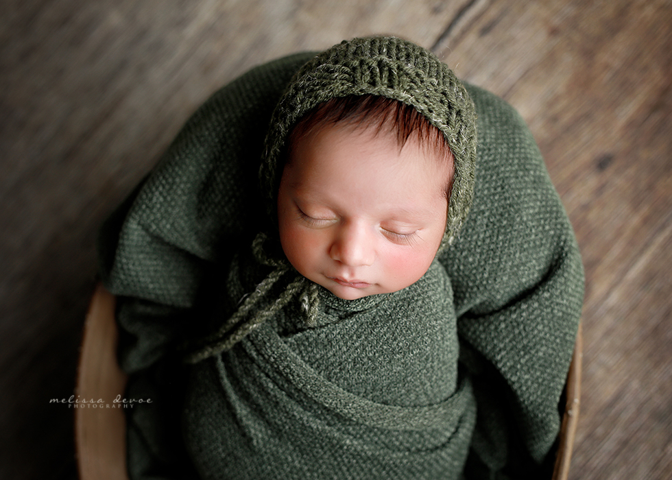 baby boy in green