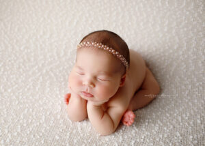 Baby girl portrait on cream