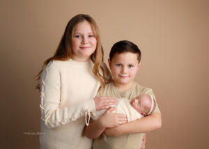 Sibling with baby photo