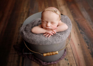 Baby in bucket with purple