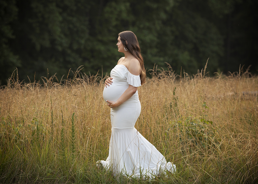 Pregnant Mom in field in long white dress