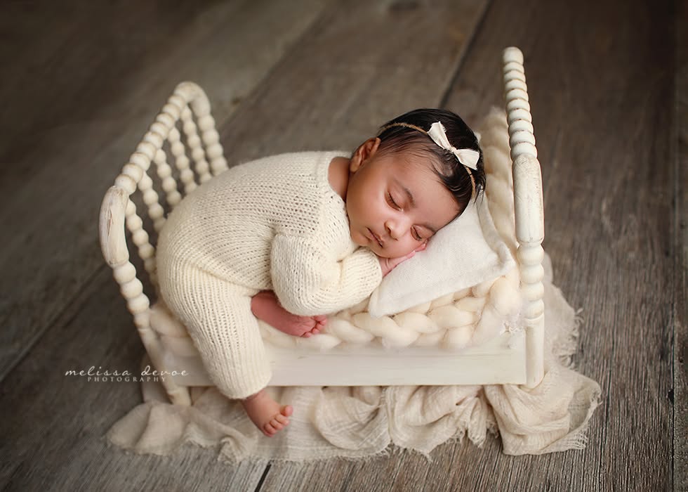 baby girl on bed sleeping