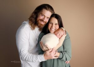newborn with family
