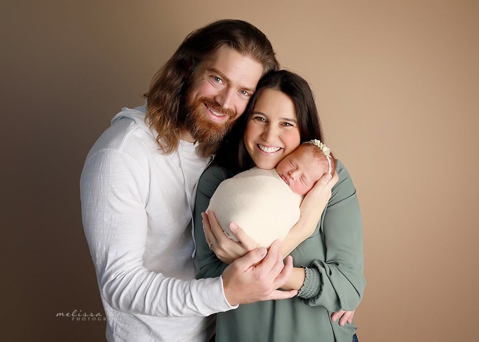 newborn with family