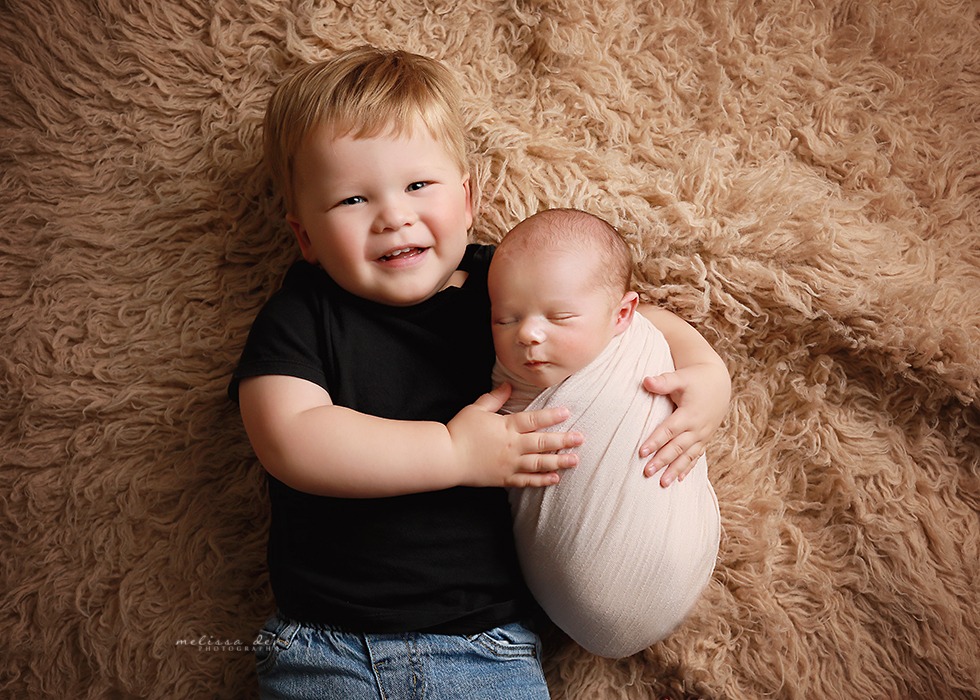 sibling with baby