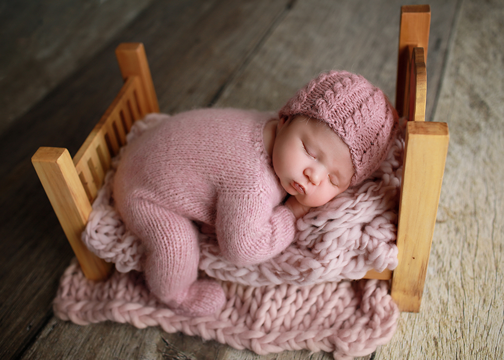 newborn potrait using bed