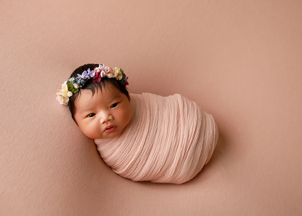 newborn girl with flower headband